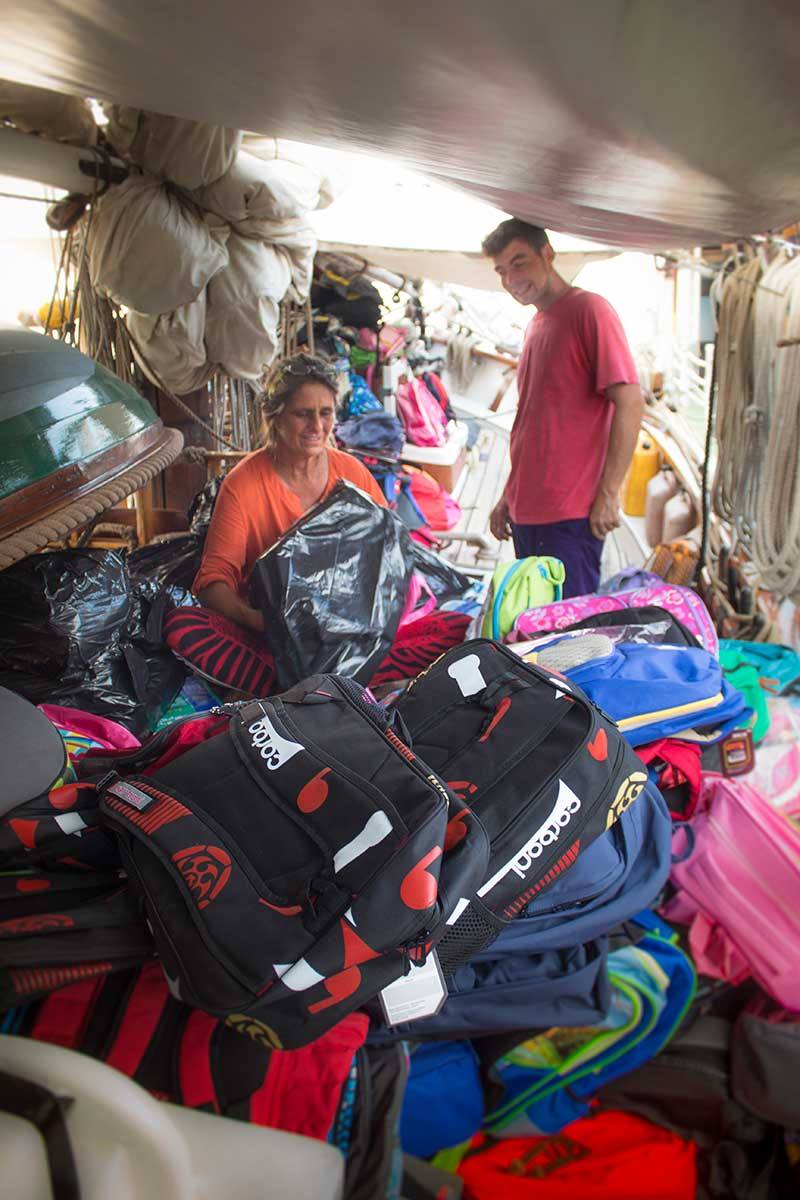 Meggi and Simon sorting and stowing bags.